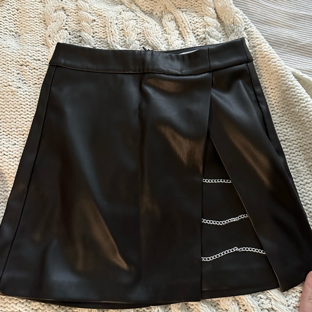 Faux leather mini skirt with silver chains on a side in size XS/0